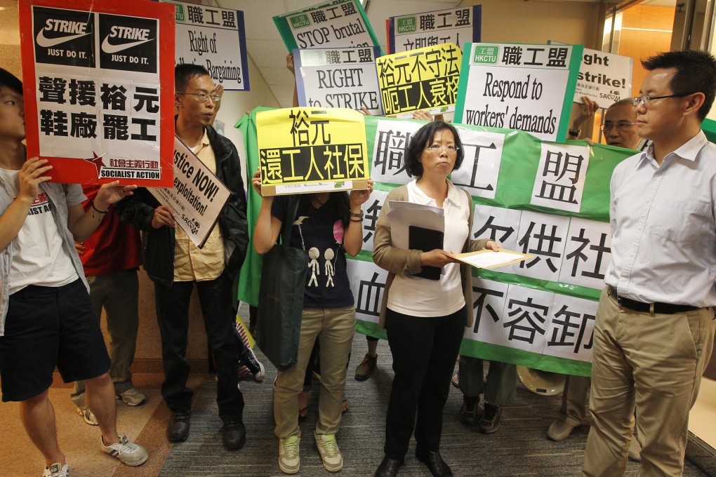 Representatives of the Hong Kong Confederation of Trade Unions and Globalisation Monitor demonstrate in support of striking workers at Yue Yuen's Tsim Sha Tsui office. Photo: Dickson Lee