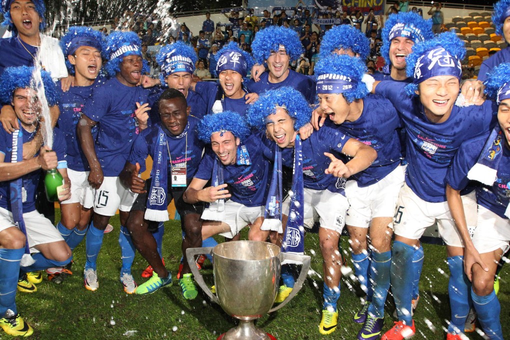 Kitchee go very blue to celebrate winning the Hong Kong First Division at Mong Kok Stadium last night, their third league title in four years. Photo: Felix Wong/ SCMP Pictures