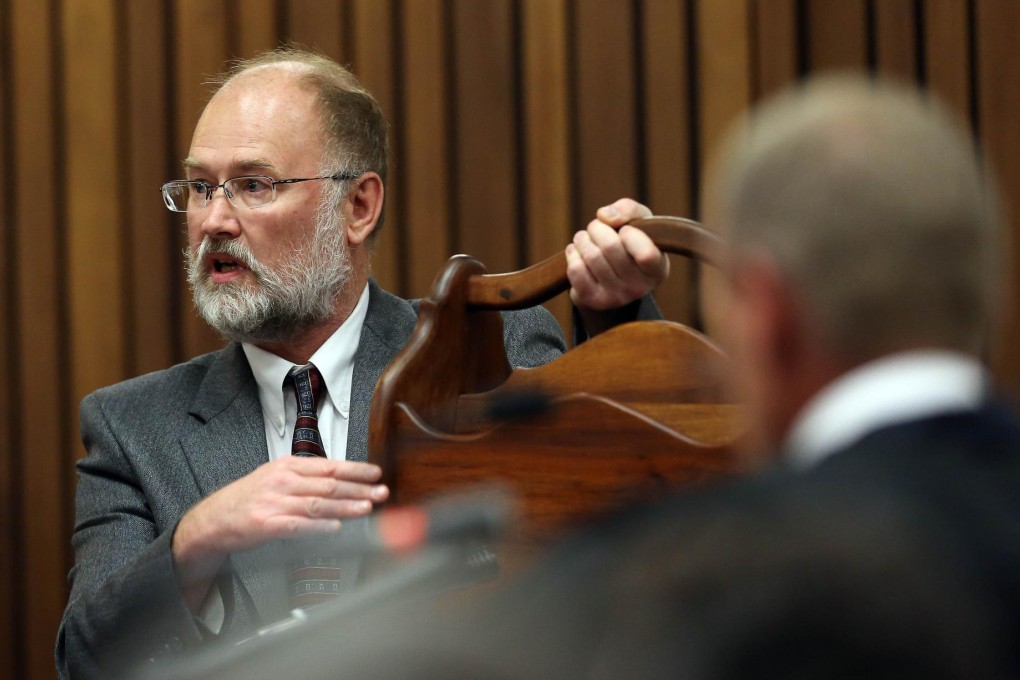 Defence witness Roger Dixon is questioned by Gerrie Nel. Photo: AFP