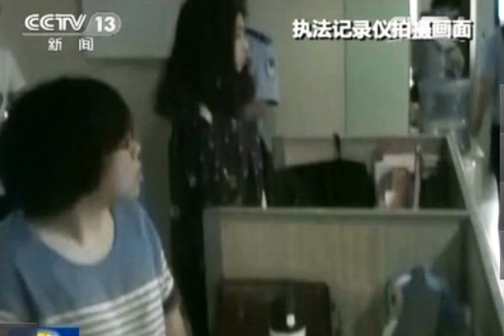 Police raid the office of Guangdong-based site Yan Yu Hong Chen. Photo: SCMP Pictures