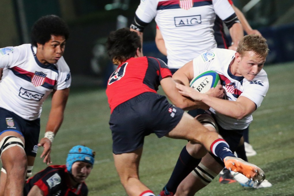 Hong Kong half-back James Christie puts his body on the line against the United States earlier in the IRB under-20s tournament. Photo: KY Cheng/SCMP