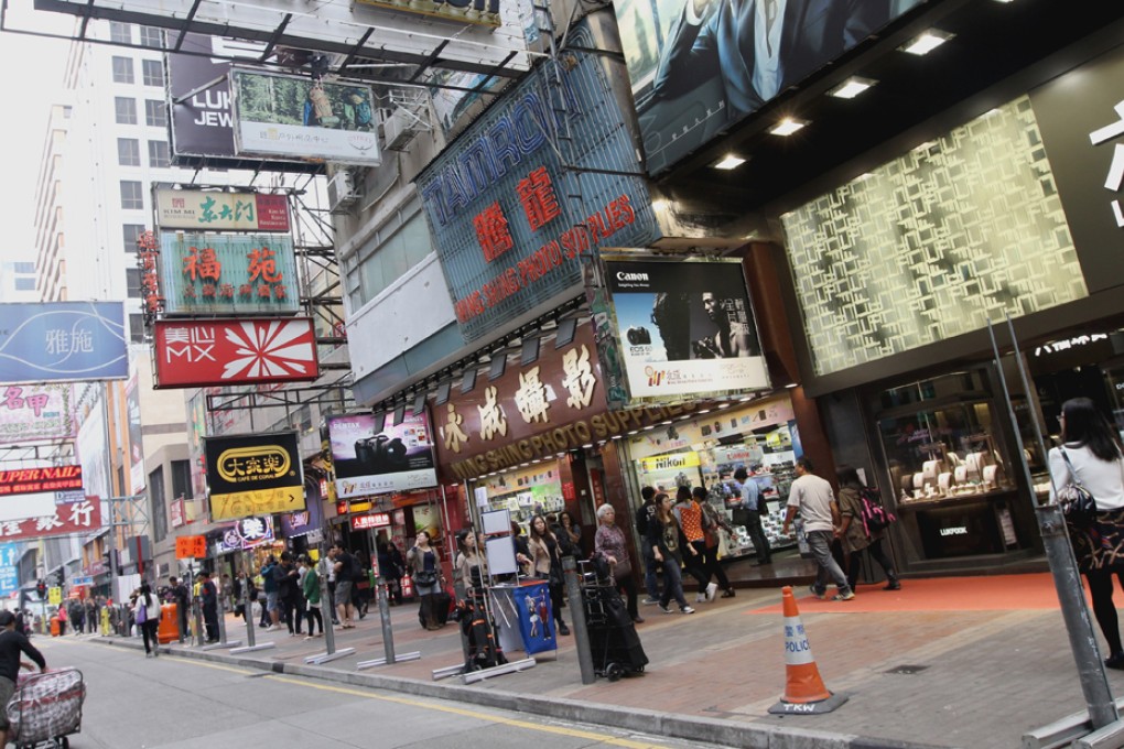 Sai Yeung Choi Street in Mong Kok. The street has become a de facto "shared space" in which pedestrians and vehicles mix.