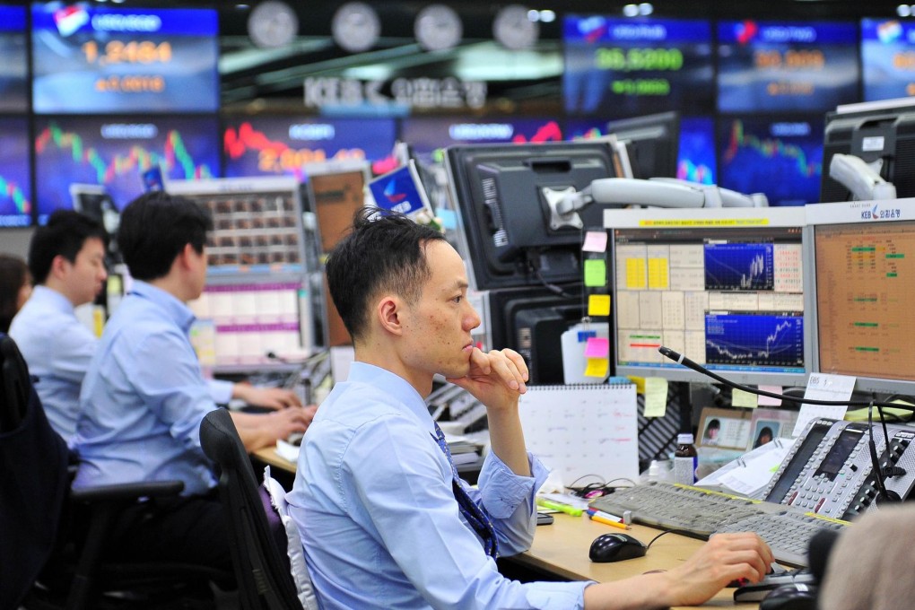 Currency traders monitor exchange rates in Seoul. Photo: AFP