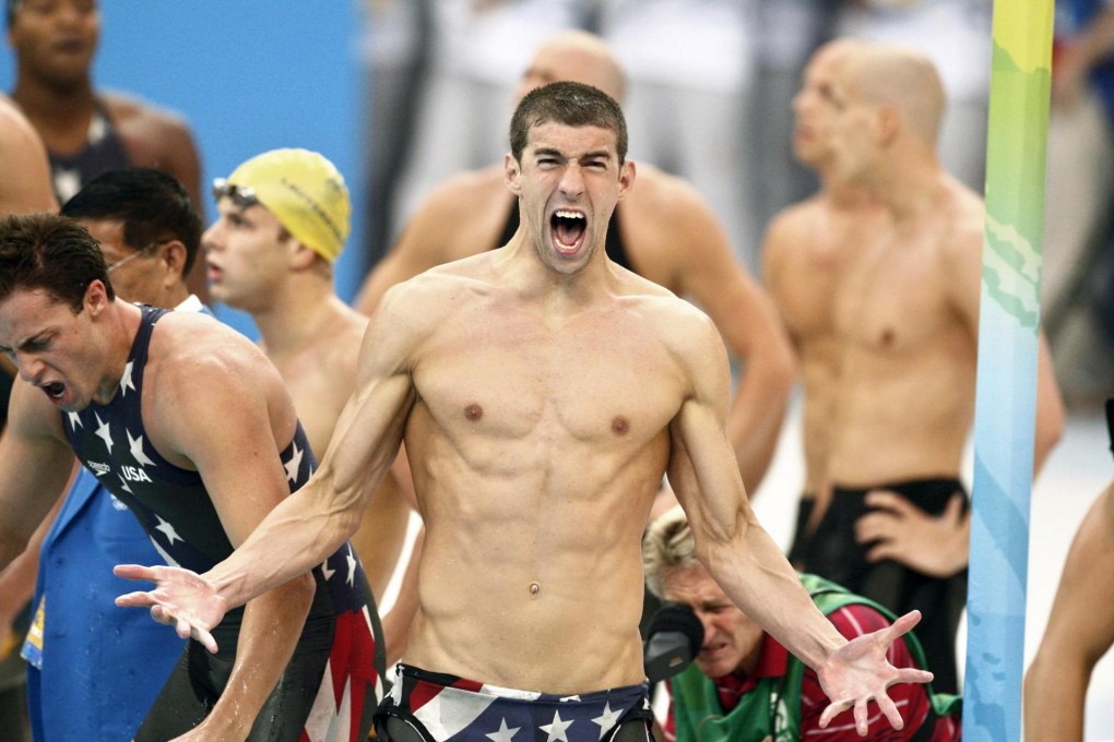 Michael Phelps is jubilant after the US men’s team clinch the 4x100m freestyle relay world record gold in 3:08.24 at the 2008 Beijing Games.  Photo: EPA