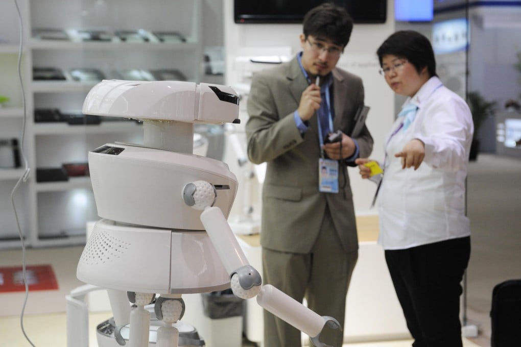 An exhibitor shows off a robot at the Canton Fair, which has seen more interest from overseas buyers due to yuan depreciation. Photo: Xinhua