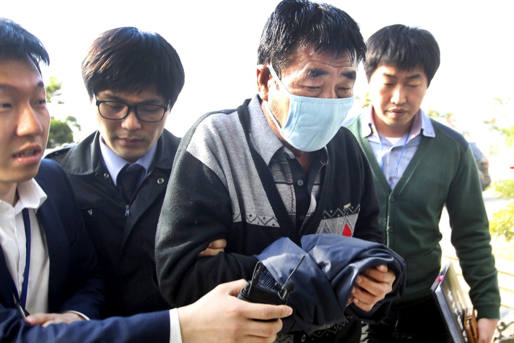 Wearing a mask, Lee Joon-seok, captain of the sunken South Korean ferry Sewol, arrives to face questioning yesterday. Photo: Reuters