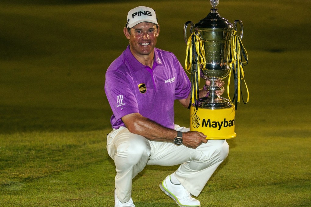 Lee Westwood poses with the Malaysian Open trophy in Kuala Lumpur. Photo: EPA