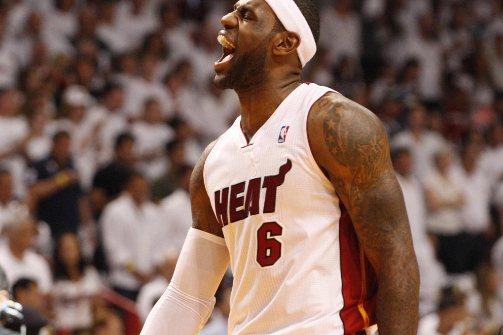 Miami Heat forward LeBron James reacts just before the start of game one in the NBA Eastern Conference quarter-finals against the Charlotte Bobcats at the American Airlines Arena. Photo: MCT
