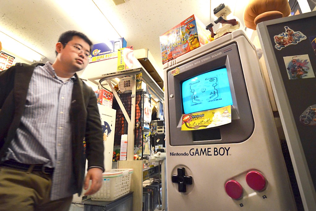 A large mock-up of a Game Boy at a shop in Tokyo. The console celebrates its 25th anniversary on Monday. Photo: AP