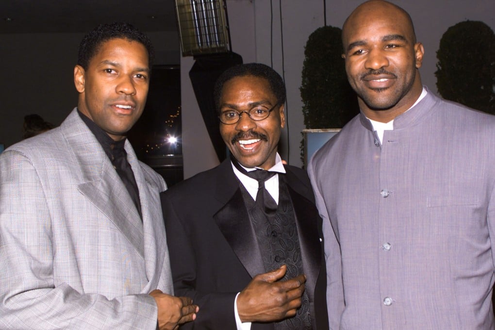 Rubin "Hurricane" Carter with Denzel Washington and Evander Holyfield in 1999. Photo: Reuters