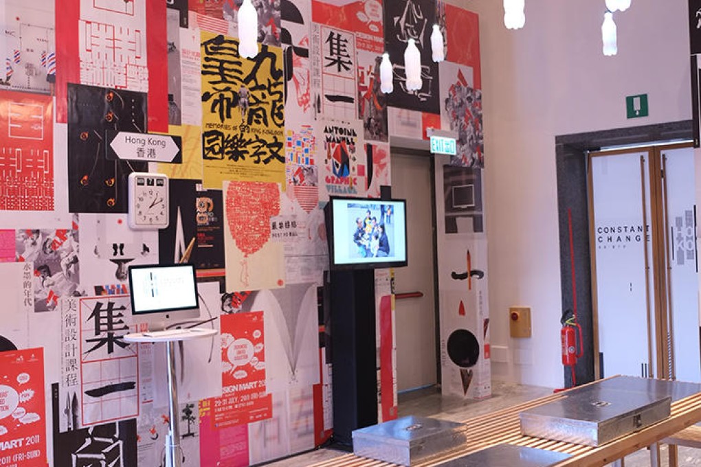 Miro's wooden benches and tables sit under Kevin Cheung'sBottle Chimes at the exhibition.