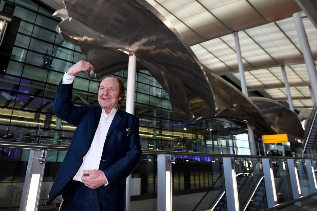 Artist Richard Wilson with his massive sculpture. Photo: AFP