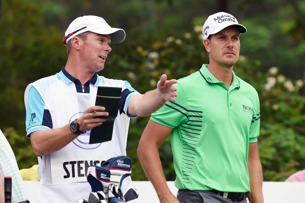 Henrik Stenson discusses tactics with his caddie during round one of the 20th Volvo China Open at Genzon Golf Club, Shenzhen. Photo: Richard Castka