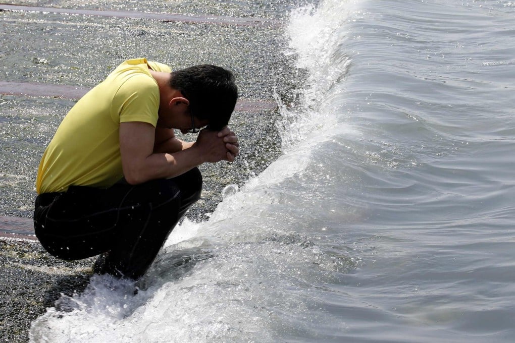 A relative of a victim onboard the Sewol ferry prays on Jindo island, where families have been waiting for news. Photo: Reuters