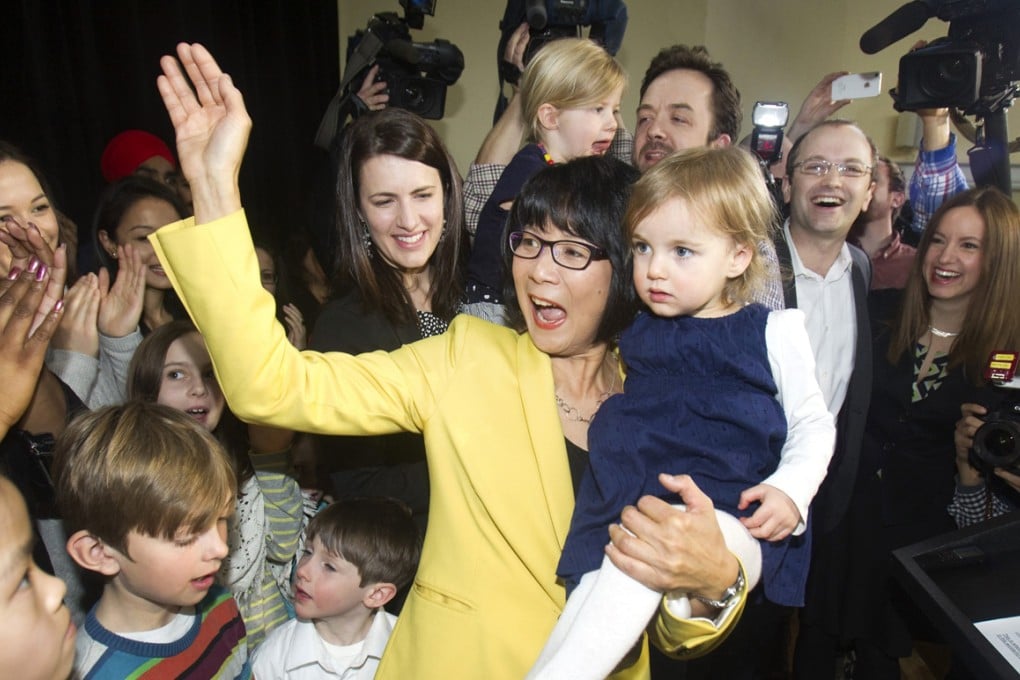 Olivia Chow with her step-granddaughter, Solace, at the press conference last month where she announced her intention to run for mayor of Toronto. Photos: Reuters; Jonathan Wong