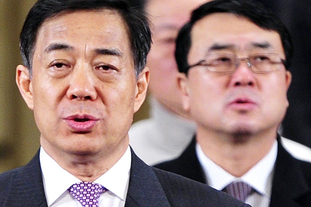Former Chongqing party boss Bo Xilai (left) and former police chief and deputy mayor Wang Lijun spearheaded a crackdown on organised crime. The campaign was lauded but also criticised for its use of "illegal tactics". Photo: Reuters