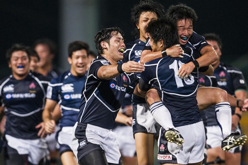 Japan’s victorious under-20s players celebrate winning the 2014 Junior World Rugby Trophy at Hong Kong Football Club on April 19. Photo: HKRFU