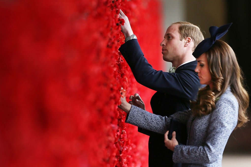 Prince William and his wife, Kate, place poppy flowers on the first world war Wall of Remembrance at the Australian National War Memorial, on Anzac Day in Canberra. Photo: Reuters