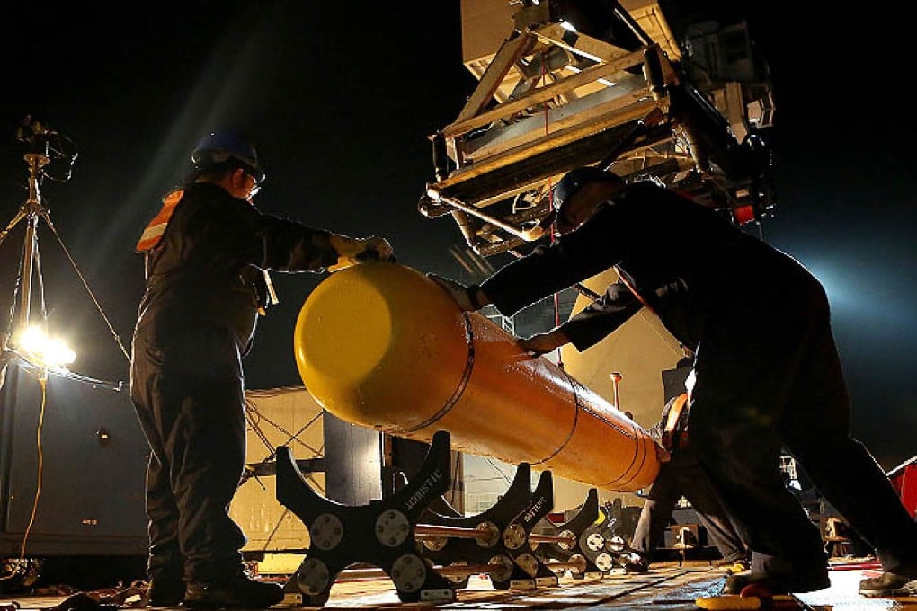 The Bluefin-21 submarine drone , is prepared for deployment from the Australian Defence Vessel Ocean Shield in the search for missing Malaysia Airlines Flight MH370 in the Southern Indian Ocean. Photo: Reuters