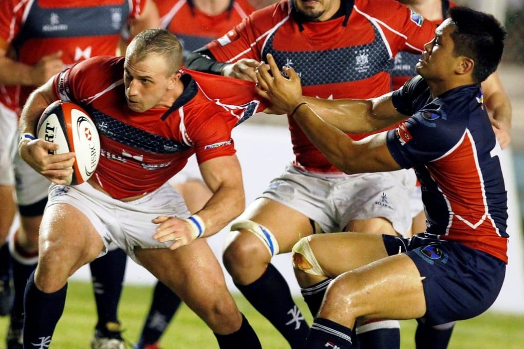 Hong Kong’s Steve Nolan looks for a way past the Filipino defence during their 2013 A5N meeting in Manila. The Volcanoes are in Hong Kong this time around and play their hosts on Saturday at HKFC. Photo: EPA