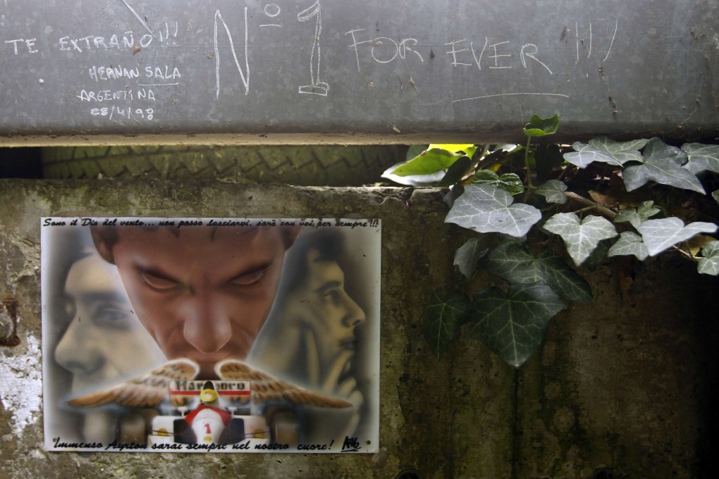 Handwritten notes left by fans are pictured on a fence at the site where Brazilian Formula One driver Ayrton Senna died at the race track in Imola. Photo: Reuters