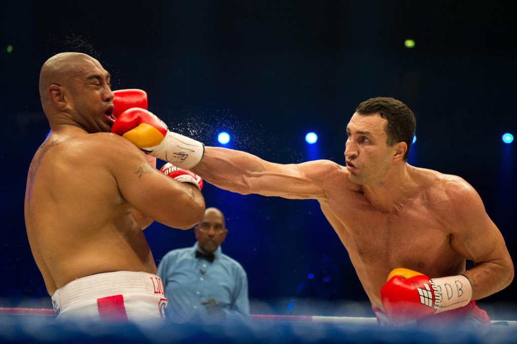 Vladimir Klitschko lands a right to the jaw of Australian challenger Alex Leapai in their heavyweight bout in Germany. Photo: EPA
