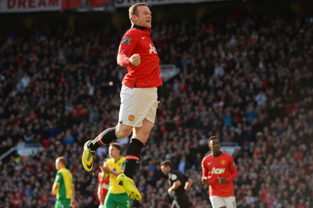 English striker Wayne Rooney celebrates after scoring a penalty for United in the first half. Photo: AFP