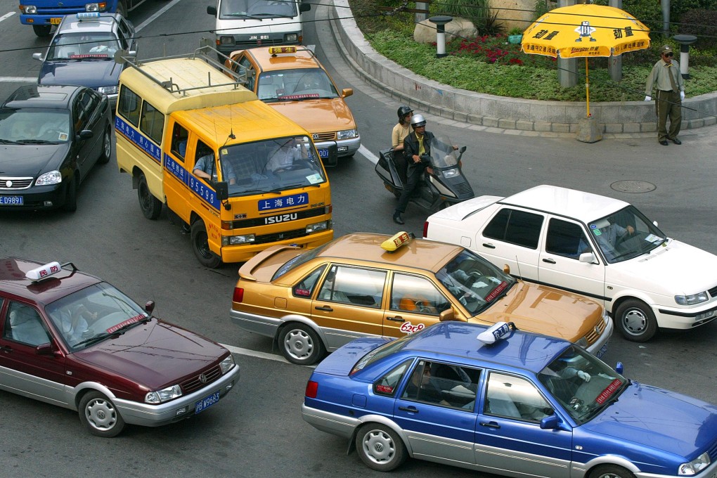 Taxi booking apps are popular in China's cities thanks to promotions and ease of use. Photo: AFP
