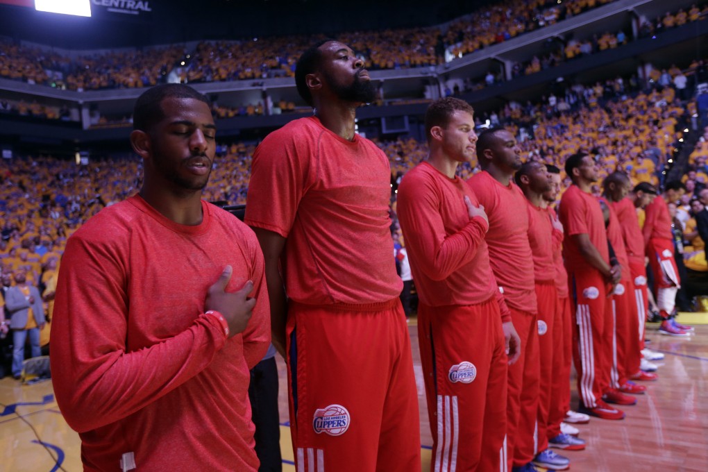 Los Angeles Clippers players listen to the national anthem wearing their warmup jerseys inside out to protest alleged racial remarks by team owner Donald Sterling. Photo: AP