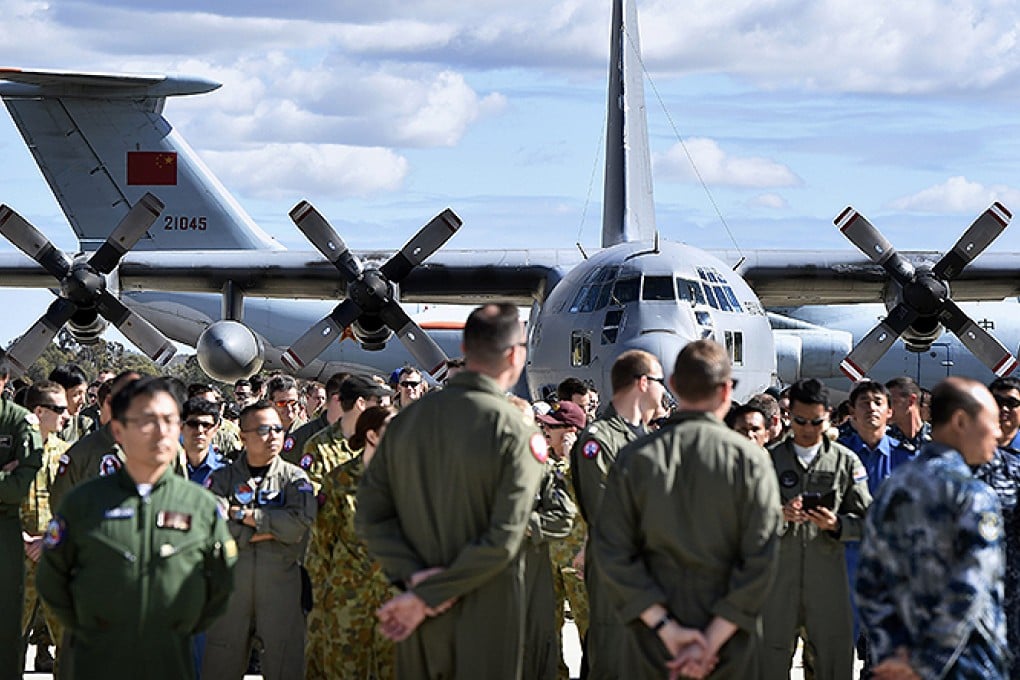 International and Australian air crews involved in search for missing Malaysia Airlines plane MH370, prepare for official photograph on the tarmac at RAAF Pearce Base in Bullsbrook. Photo: Reuters