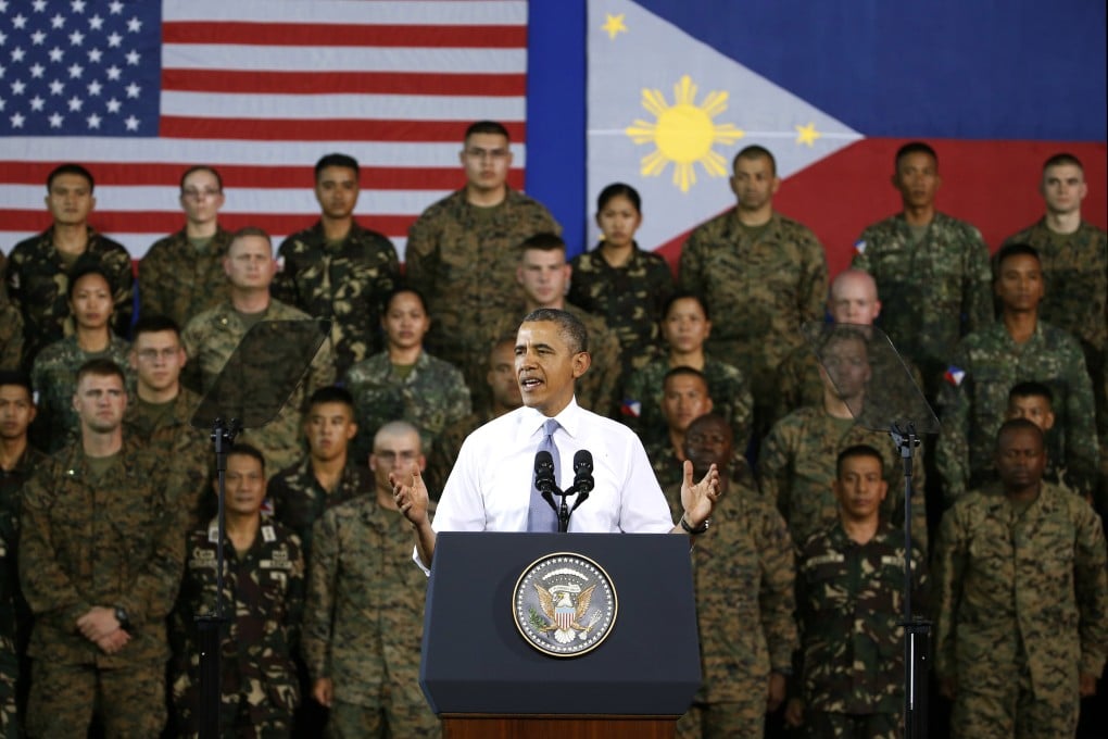 President Barack Obama addresses US and Philippine troops at Fort Bonifacio in Manila. He warned China against using force to resolve territorial disputes. Photo: AP