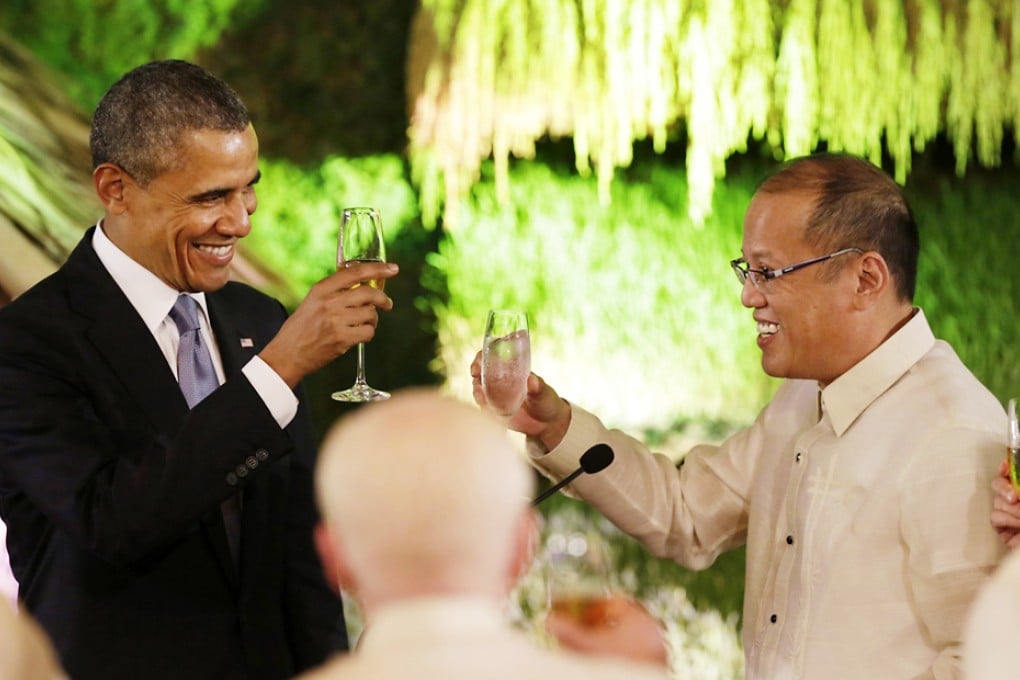 Obama toasts with President Benigno Aquino during a dinner whose guest list included many politicians with checkered pasts. Photo: Reuters