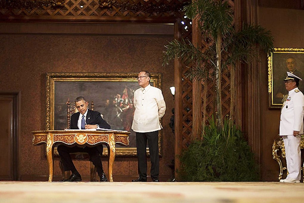 US President Barack Obama, who met his Philippine counterpart Benigno Aquino (centre) yesterday, insisted the Washington-Manila pact would promote peace and stability in the region. Photo: AFP