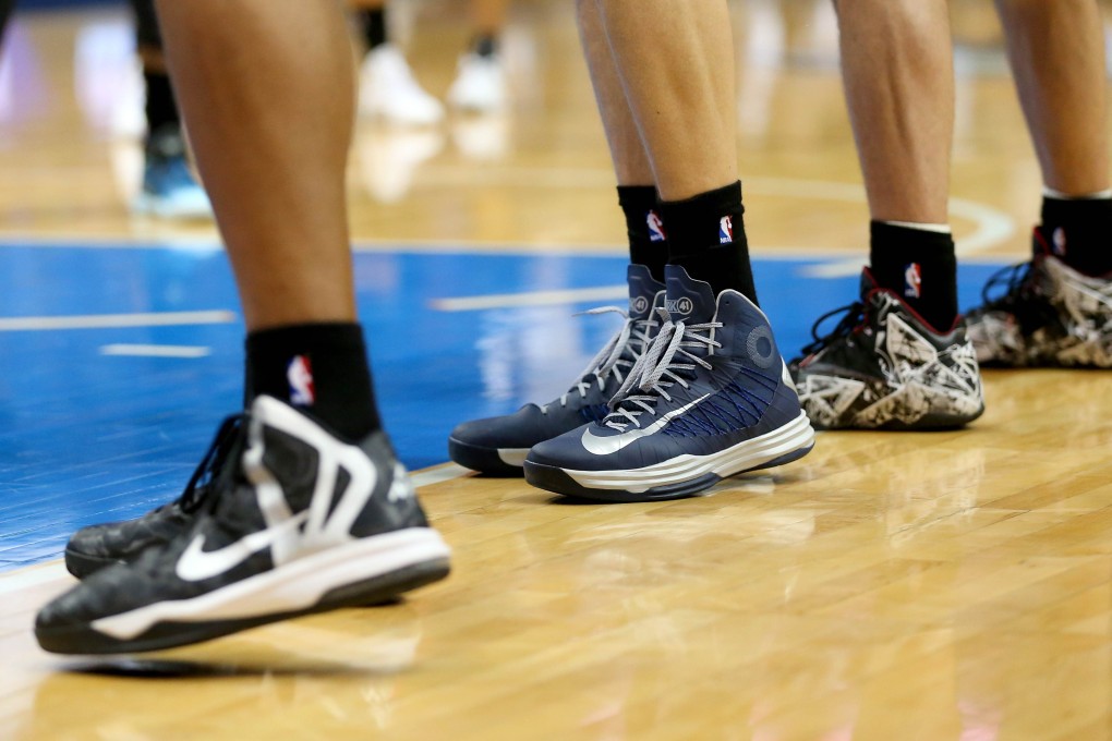 Dallas Mavericks and San Antonio Spurs players wore black socks during their match on Monday, in protest at the racist comments allegedly made by Los Angeles Clippers owner Donald Sterling. Photo: AFP