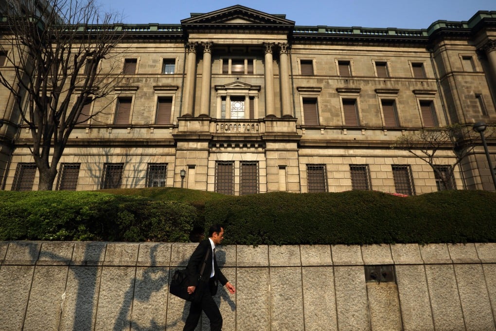 The Bank of Japan projects inflation to rise this year and stay at about 2 per cent for two years from mid-2015. Photo: Bloomberg