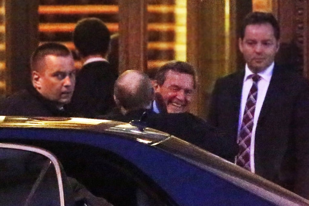 Russian President Vladimir Putin (centre) and former German chancellor Gerhard Schroeder meet in the Yusupovsky palace at a North Stream reception on the occasion of Schroeder's 70th birthday in St. Petersburg, Russia. Photo: EPA