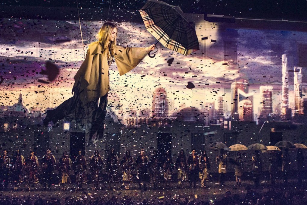Model and "it" girl Cara Delevingne performs on stage as part of fashion label Burberry's London to Shanghai promotional event.