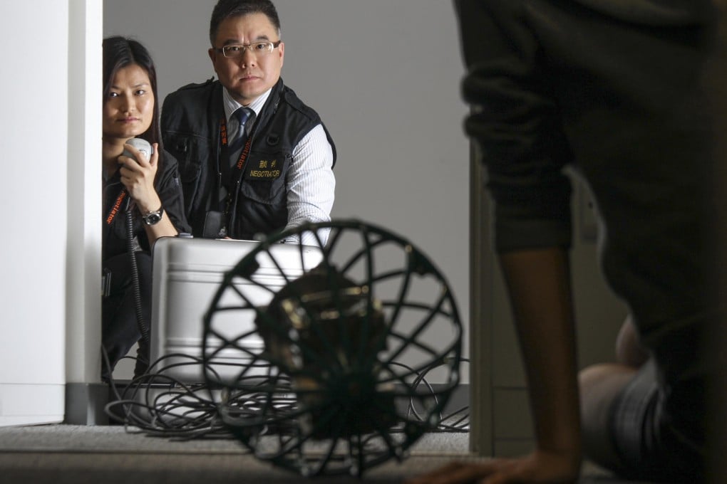 Sindy Chan (left), senior inspector of the Complaints Against Police Office, and Gilbert Wong, senior superintendent of the Service Quality Wing. Photo: Dickson Lee