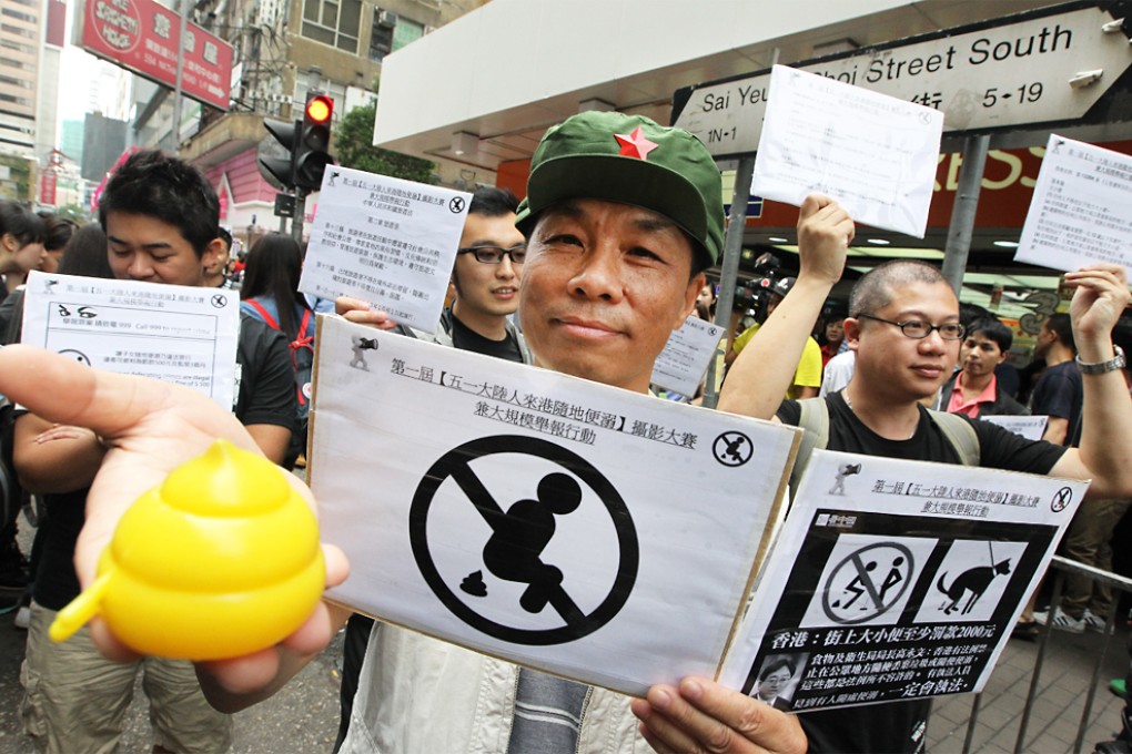 A yellow fake faeces prop was on display at the public launch of the photography contest in Mong Kok yesterday. Photo: Felix Wong