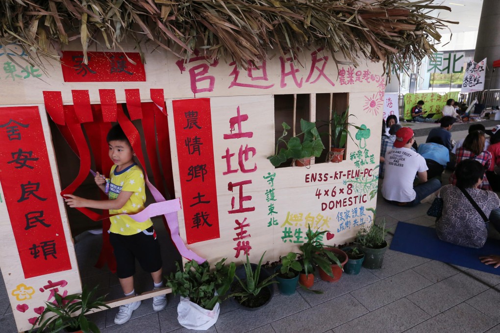 Protesting villagers built a house outside Legco. Photo: K.Y. Cheng
