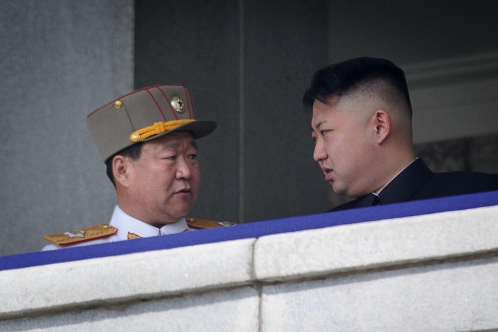 Supreme leader Kim Jong-un with the man believed to be Choe Ryong-hae (left), who has been replaced as the country's No 2. Photo: AFP