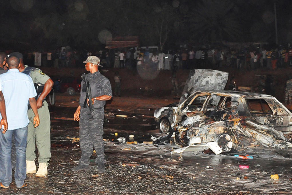 Rescuers work at the blast site in Abuja on Thursday. Photo: Xinhua