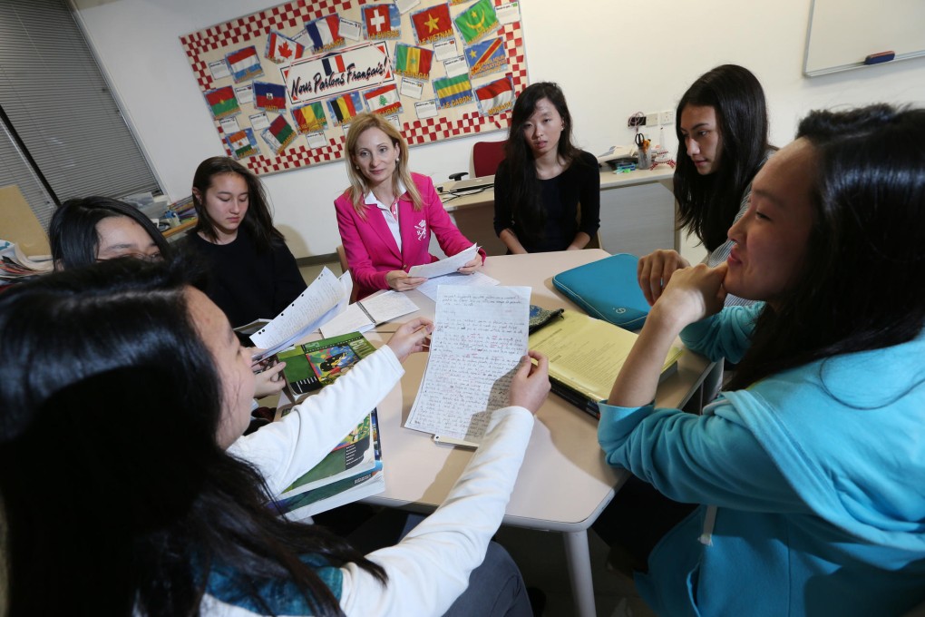Grier with students at Chinese International School. Photos: David Wong