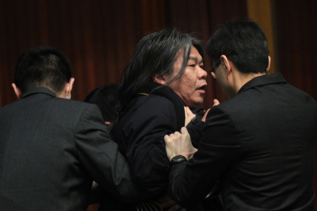 Lawmaker Leung Kwok-hung is removed from chamber protest as Financial Secretary John Tsang announces the budget. Photo: SCMP