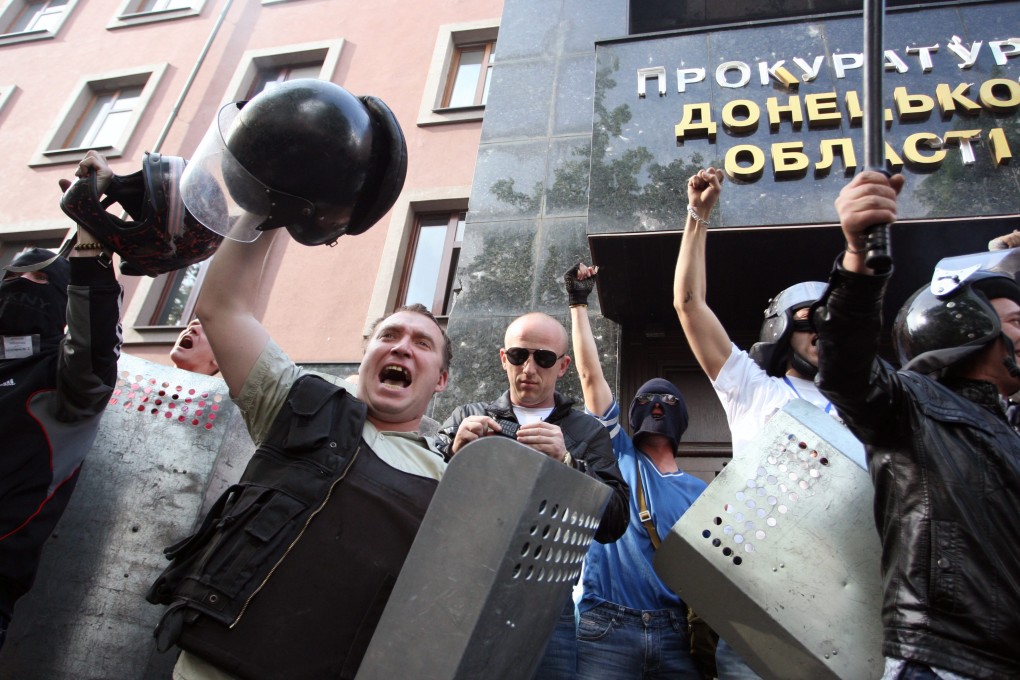 Pro-Russian protesters seized the regional prosecutor's office, after the May Day rally turned violent in Donetsk, Ukraine. Photo: EPA