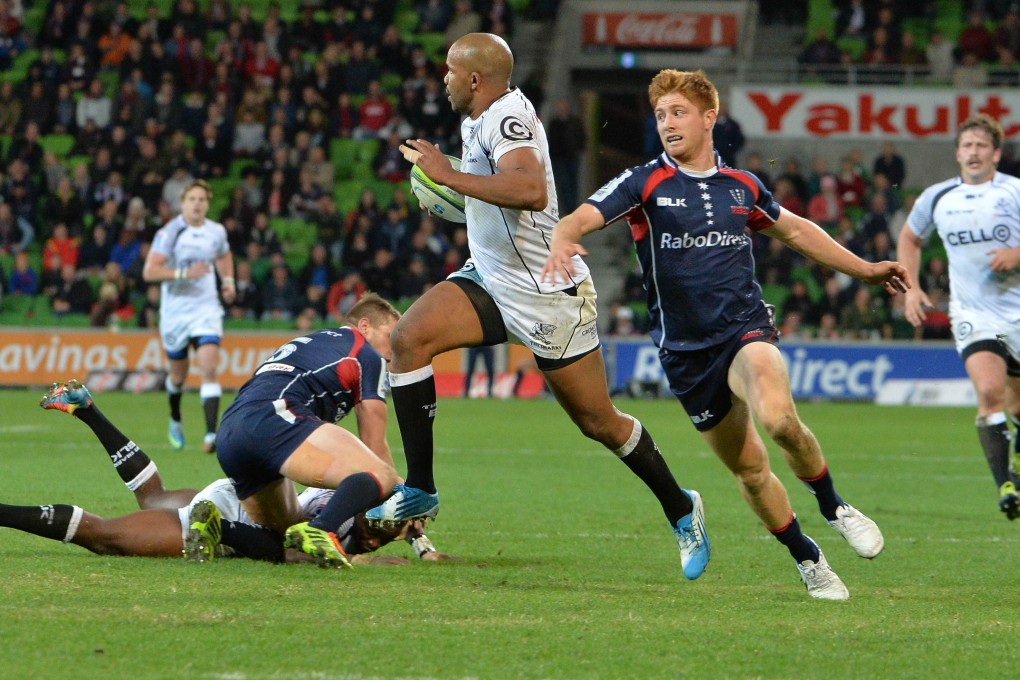 Sharks winger JP Pietersen makes a break for the try line in their match against the Rebels in Melbourne. Photo: AFP