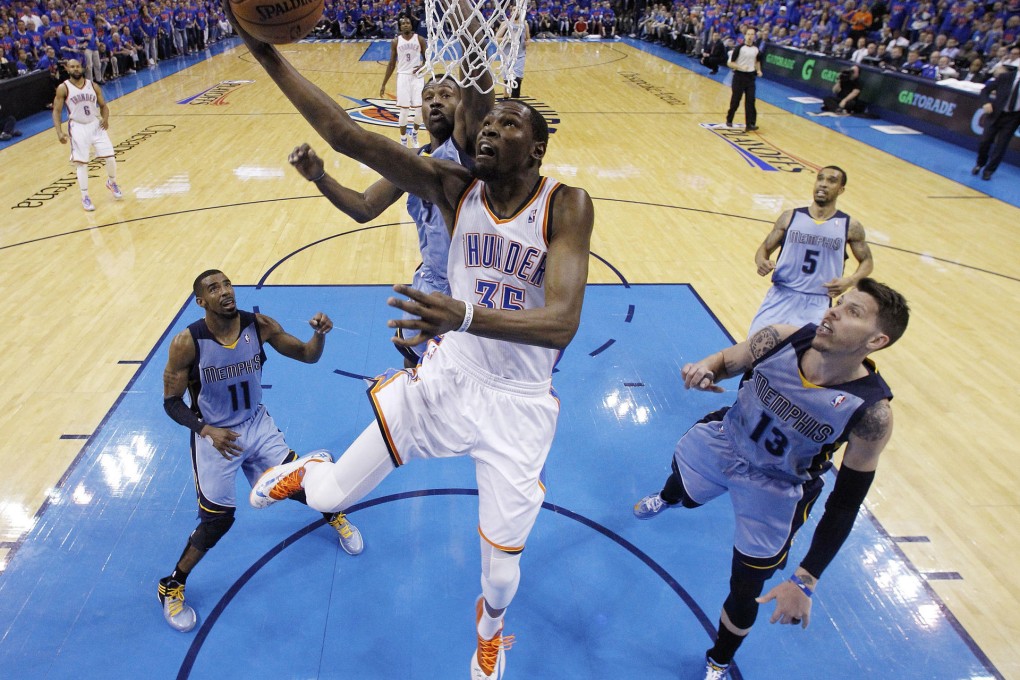 Thunder's Kevin Durant (35), who scored 33 points in total, shoots in game seven, beating Grizzlies guard Mike Conley. Photo: AP