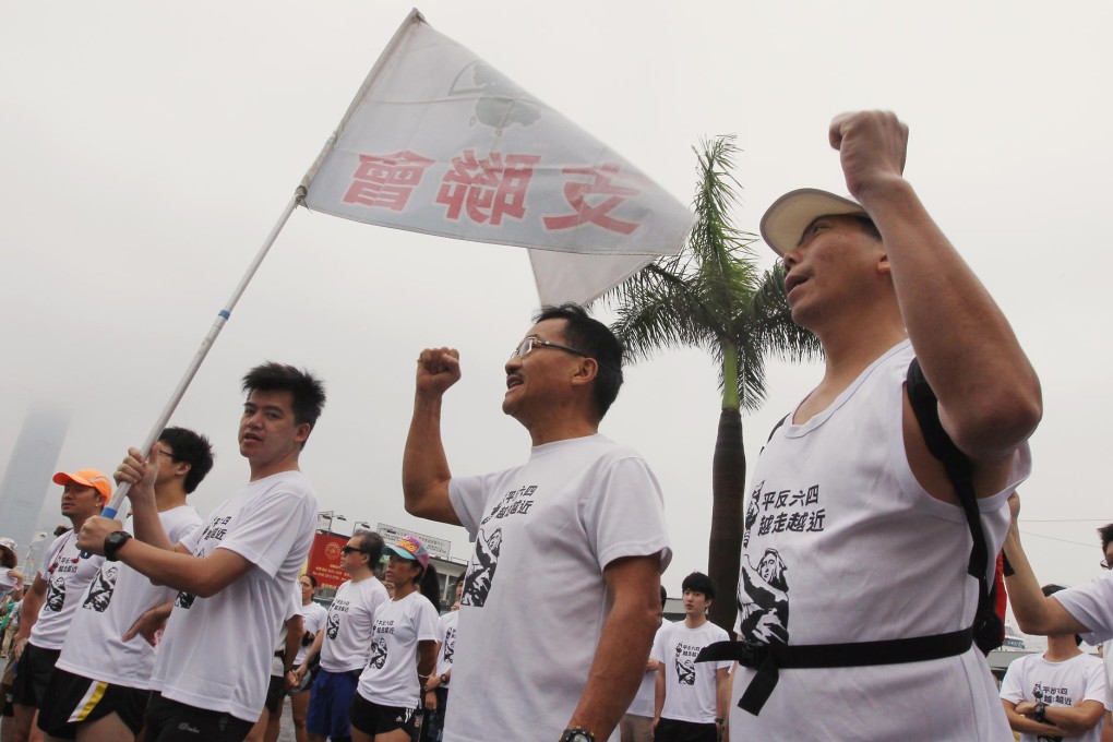 Members of the alliance gather in Tsim Sha Tsui ahead of yesterday's run to mark 25 years since the June 4 crackdown. Photo: Edward Wong
