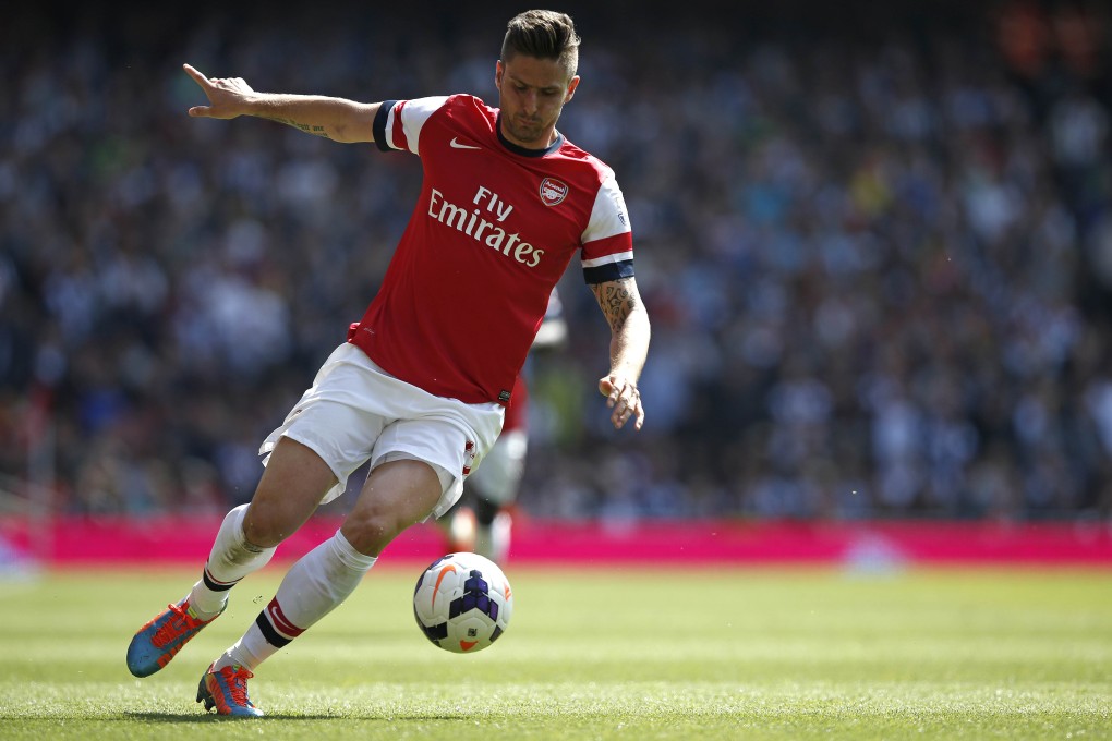 Arsenal striker Olivier Giroud on the attack against West Bromwich Albion at The Emirates Stadium. Photo: AFP