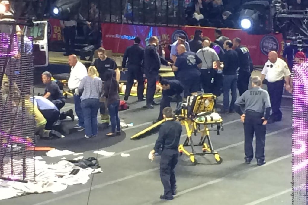 Emergency workers arrive to help the acrobats. Photo Reuters